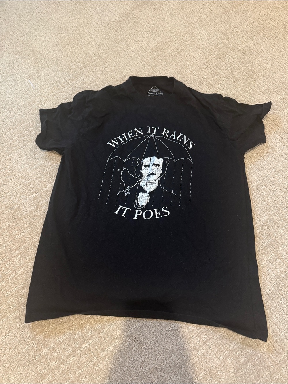 Black Graphic Tee - When It Rains It Poes